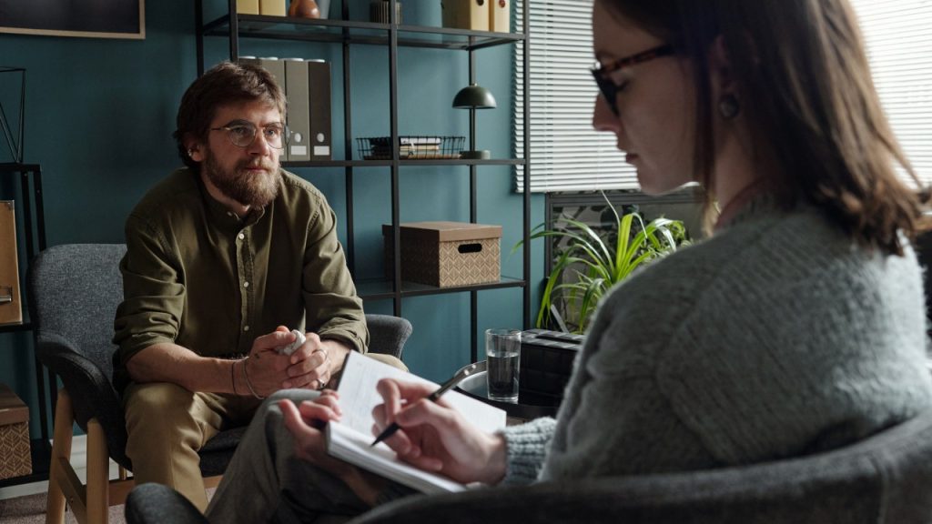Mental health professional helping a patient take the first step toward lasting recovery