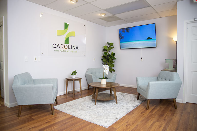 Cozy waiting area at Carolina Outpatient Detox, a detox center in Raleigh, NC, featuring comfortable seating for patients.