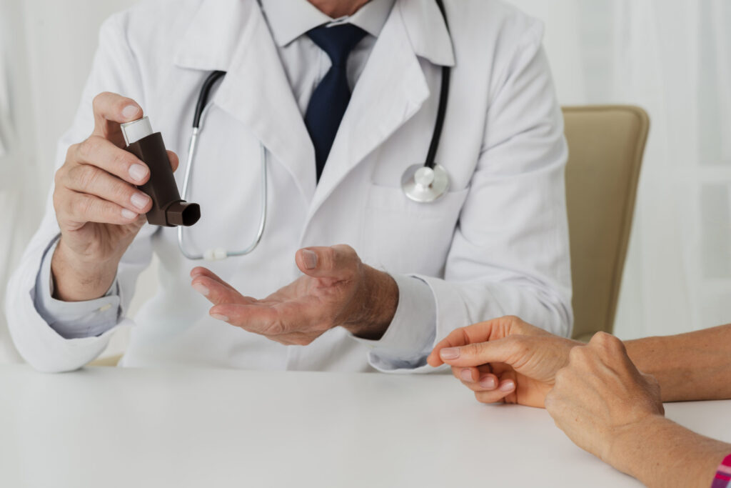 Medical professional explaining heroin detox steps to an individual, using an inhaler as part of the instruction