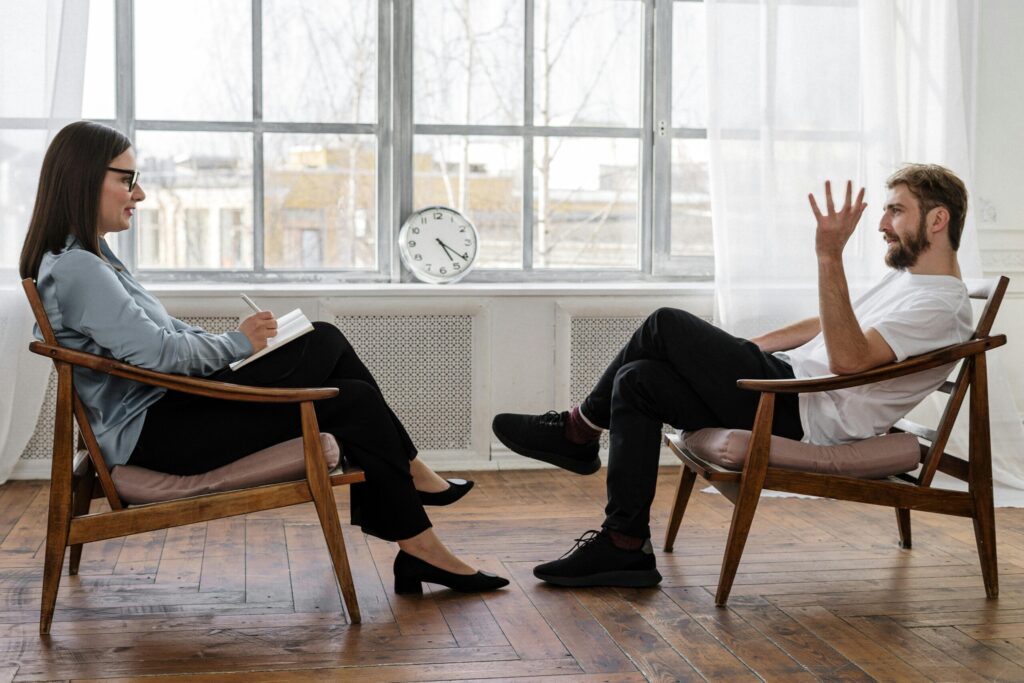 Medical professional guiding a person through the opioid withdrawal management process at an outpatient clinic