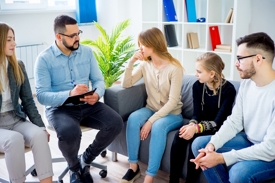Teens participating in therapy session for vaping addiction recovery