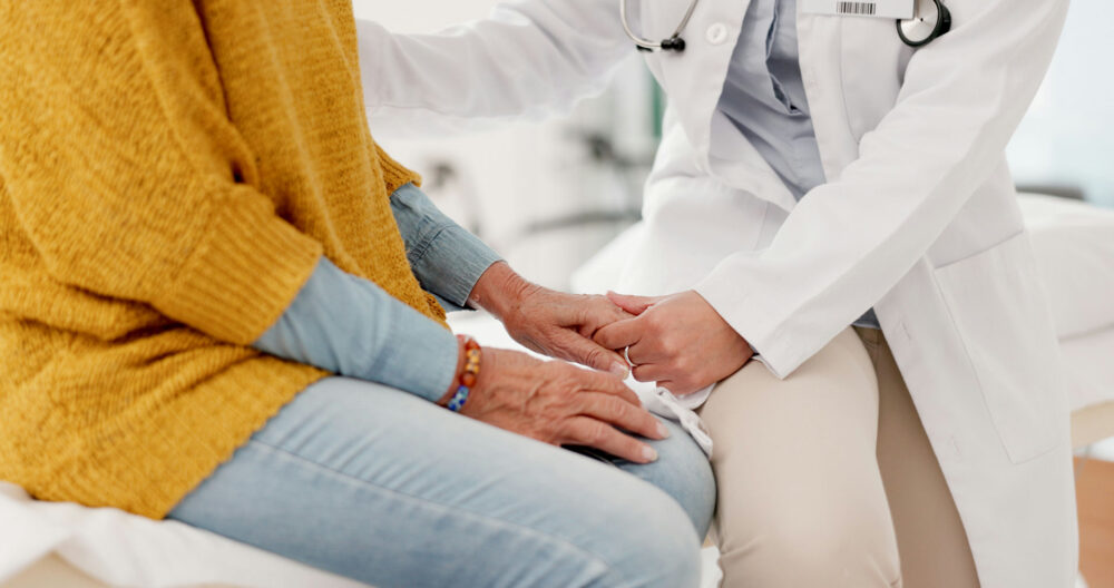 Doctor reassuring woman about medical detox medication.