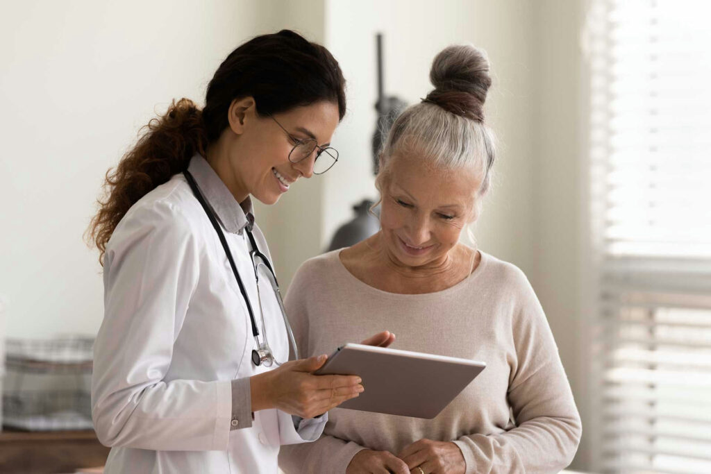 Doctor reviewing a table with a woman in outpatient detox for addiction.