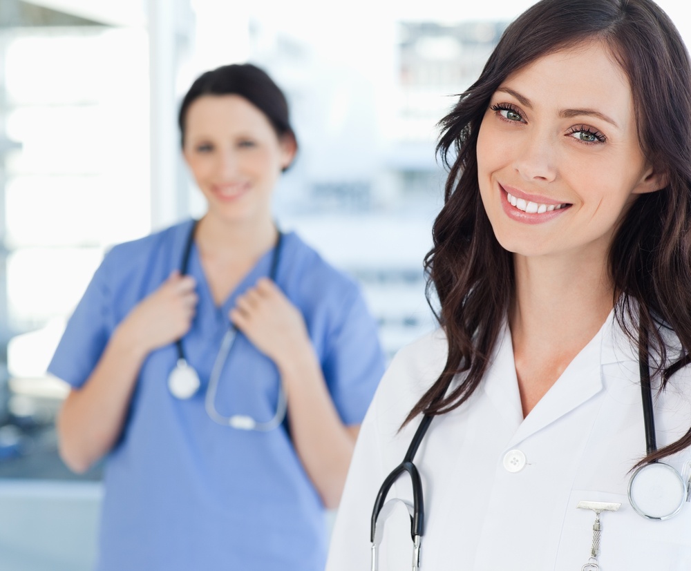 Friendly doctor and nurse welcoming people to medical detox in North Carolina.
